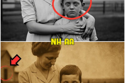 A Woman Hugs Her Son in 1931 — But Zooming In on the Boy’s Face, Something Feels Off