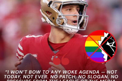 🛑 LATEST NEWS: San Francisco 49ers quarterback Brock Purdy stunned the NFL world when, ahead of a major prime-time game, he flat-out refused to wear a rainbow-themed captain’s patch designed to show solidarity with the LGBTQ community. Instead, Purdy delivered a blunt statement blasting what he called the “woke agenda” and insisted he would never endorse it — a move that instantly divided fans across the Bay Area and the nation.